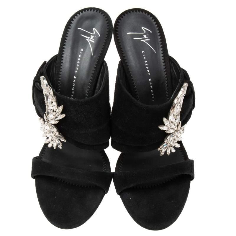 These sandals from Giuseppe Zanotti are perfect for dinner parties! They are made from black suede and come with a crystal-embellished Wing buckle. These sandals are adorned with silver-tone hardware.

Includes: Original Dustbag

