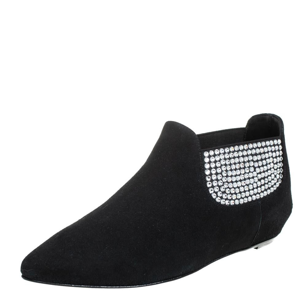 These flat booties from Giuseppe Zanotti spell everything chic and modern! They are crafted from black suede and adorned exquisitely with dazzling crystal embellishments. They feature pointed toes and come endowed with comfortable leather-lined