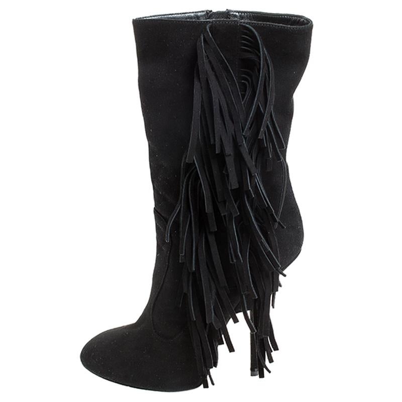 If you know your fashion well, these Giuseppe Zanotti boots are just what you need to make a style statement. Crafted from suede, the boots arrive in black. They feature round toes, fringe details and 13 cm heels. They reflect excellent