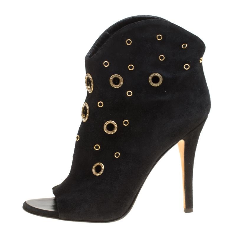 These booties from Giuseppe Zanotti are bearers of a fine mix of shoe craftsmanship and style. The suede pair carries a superb design of crystal-embellished eyelets, peep toes and finely-sculpted heels that will beautifully lift you and your