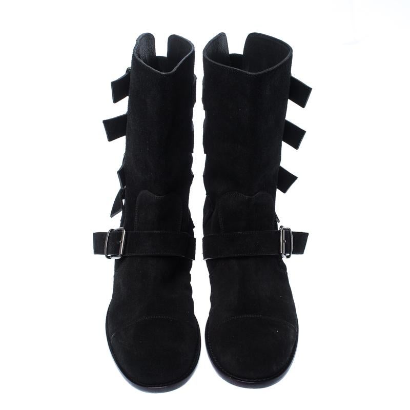 Giuseppe Zanotti introduced these ankle boots to delight the tastes of all fashion-forward ladies. These round-toe boots are designed with buckled straps around the vamps and counters and are rendered in smooth black suede. The pair is complete with