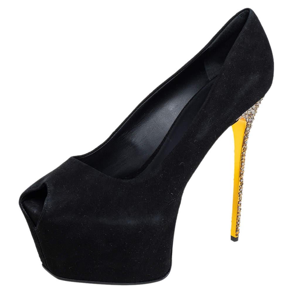 You can never go wrong with these stylish Giuseppe Zanotti pumps. Crafted in Italy, they are made from black suede. They are styled with peep toes, 15 cm high heels embellished with crystals and supported by platforms, and a sculpted top line. They