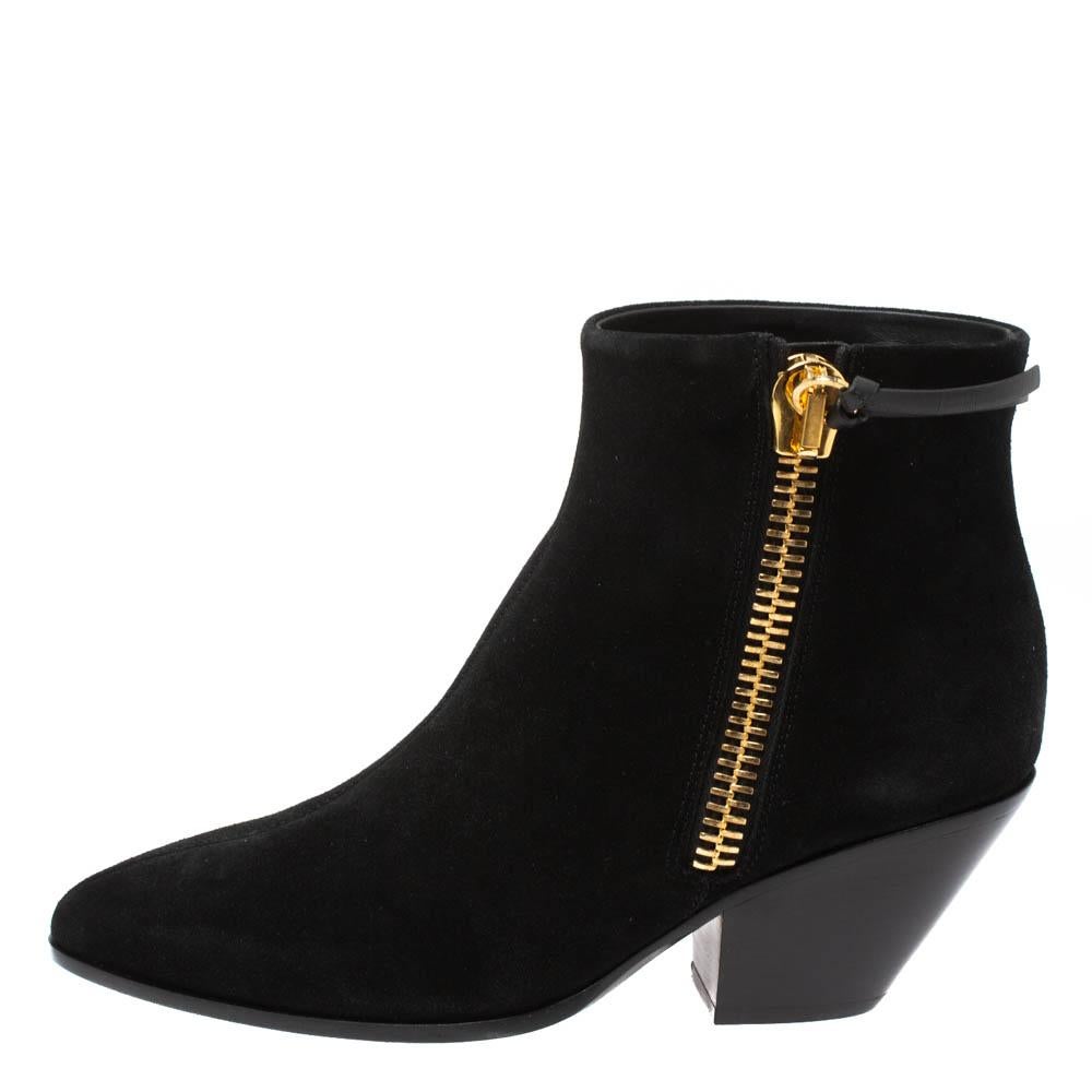 Never go out of style with this pair of classy ankle boots from the house of Giuseppe Zanotti. Be at your stylish best at all times with these fabulous black-hued boots. Crafted from suede, they are styled with gold-tone hardware, zip closures,