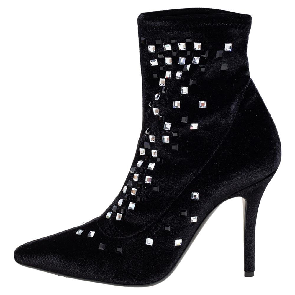 A pair of designer boots by Giuseppe Zanotti to light your steps in a fashionable manner. The black boots are finely crafted from velvet and designed with pointed toes, 10 cm heels, and embellishments.

Includes: Price Tag