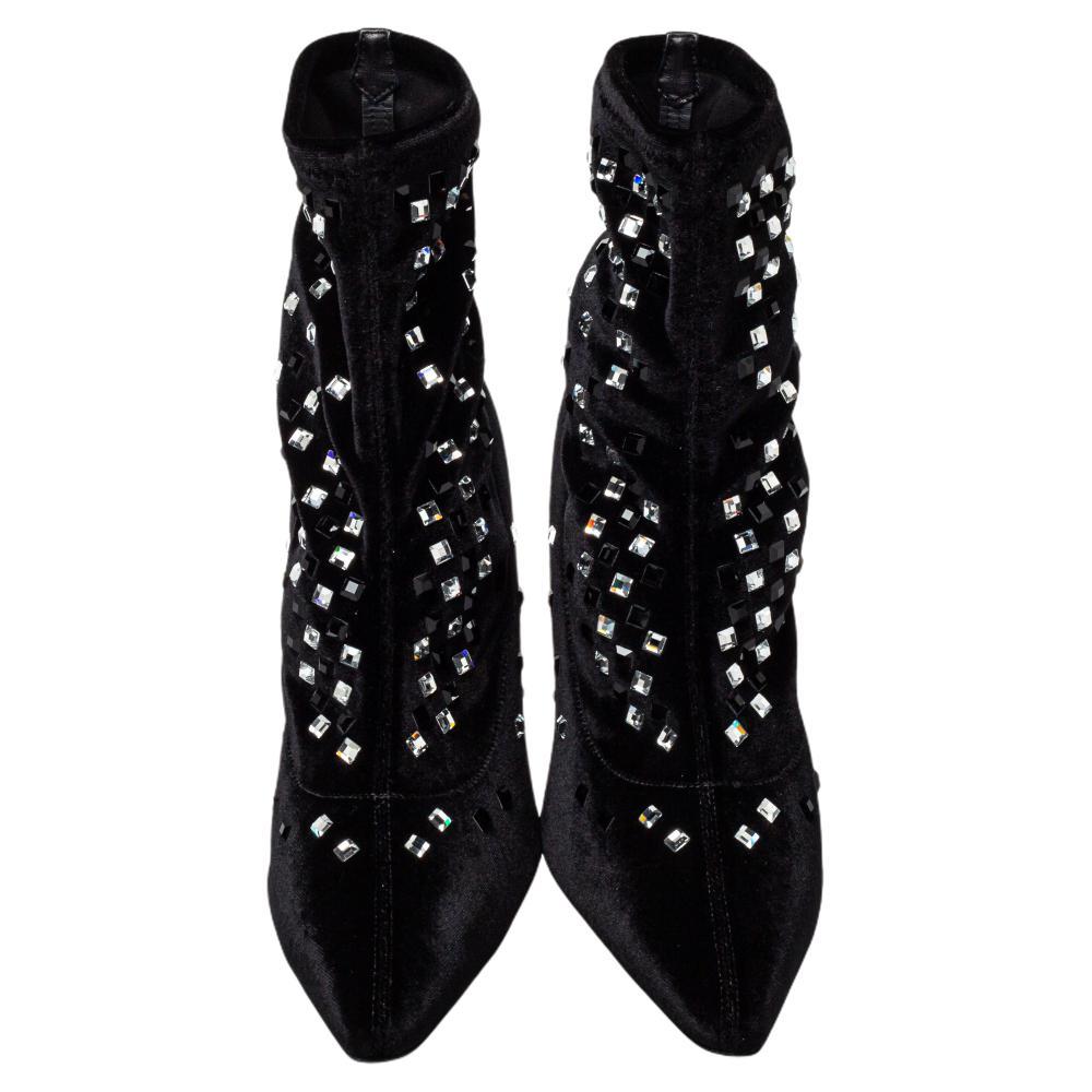 How can one not fall in love with these gorgeous boots from Giuseppe Zanotti! Crafted from velvet, these black boots feature pointed toes and gorgeous crystal embellishments. They are elevated on high heels and made comfortable with leather-lined