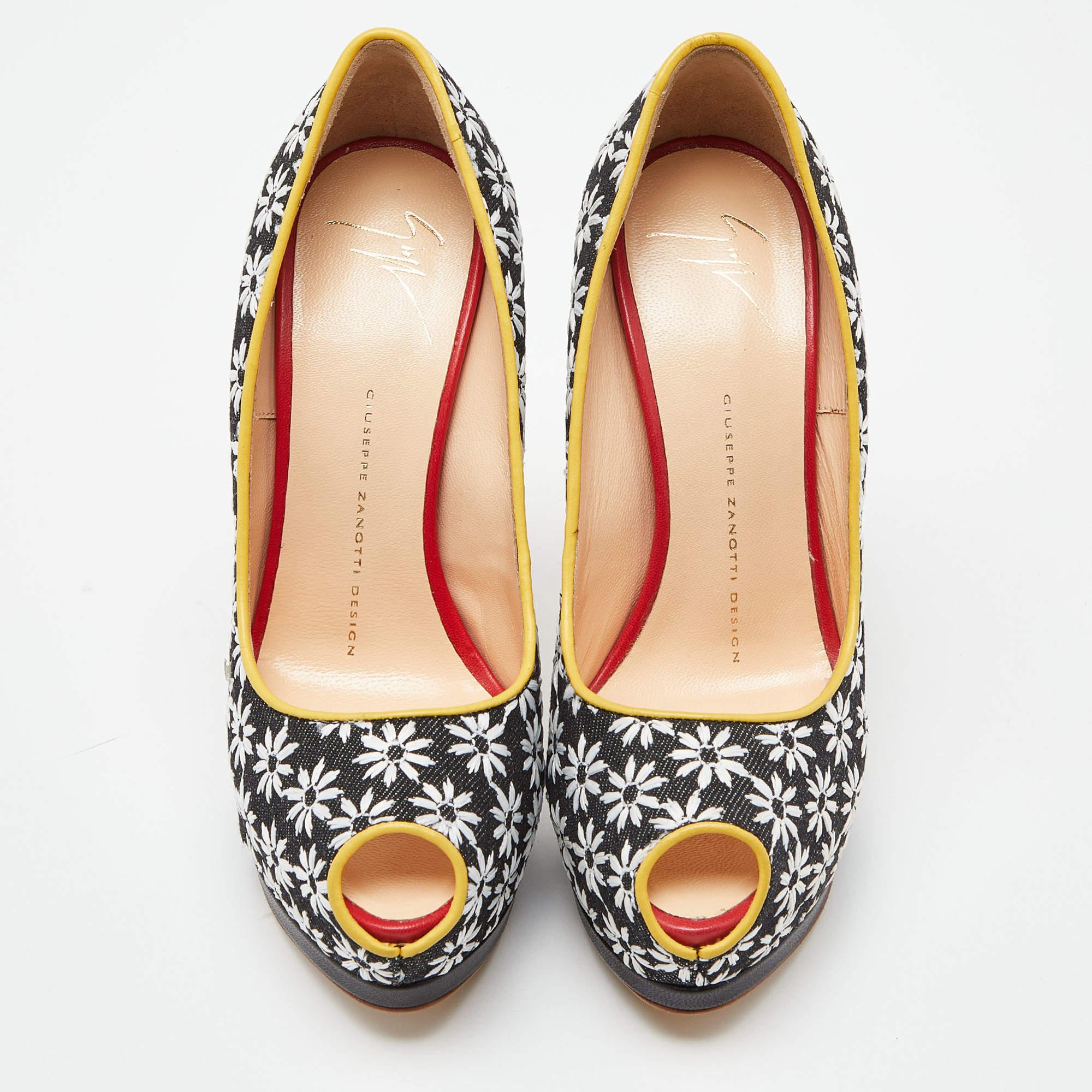 Own this meticulously designed pair of Giuseppe Zanotti pumps today and dazzle everyone whenever you step out! Crafted out of embroidered canvas, these pumps feature peep-toes. They have been beautified with 15.5cm heels.

Includes: Original