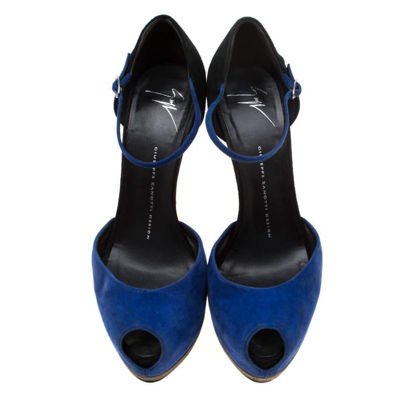 Sure to help you stand tall, these Giuseppe Zanotti sandals will make a fine addition to your shoe closet. They are crafted from suede, in a mix of blue and black shades. The sandals feature peep-toes, ankle straps and 15 cm heels supported by