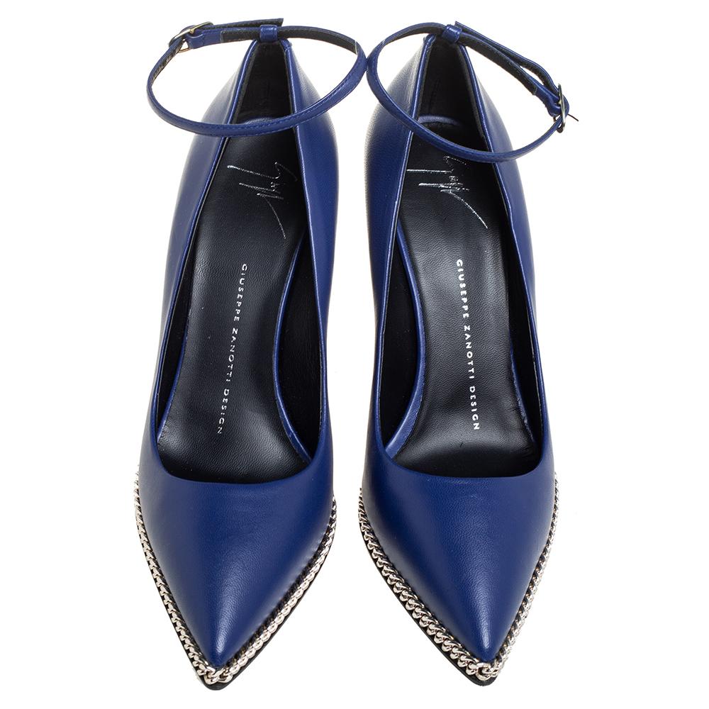 Giuseppe Zanotti yet again takes a simple silhouette and adds a chic touch to it! These pumps have been crafted from leather in a blue shade and elevated by chain details tracing along the pointed toes and the wedge heels.

Includes: Original