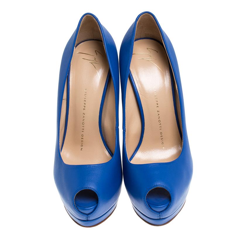 Sturdy and durable, these pumps, crafted out of smooth leather, will lend a sophisticated vibe to your look. The Giuseppe Zanotti pumps feature peep toes, platforms and 14 cm heels. The blue pair is complete with leather insoles.

Includes: Original