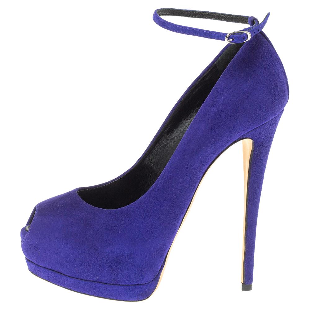 Jazz up your everyday look by flaunting these pumps crafted from suede. Your everyday styling will be complete with this pair from Giuseppe Zanotti. The pumps feature peep toes, ankle straps, and 14 cm heels supported by platforms.

Includes: