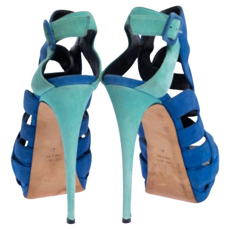 These sandals from Giuseppe Zanotti are perfect for adorning your delicate feet. The blue-hued sandals are crafted from suede and feature an open toe silhouette. They flaunt cutouts and buckle fastening. Comfortable leather-lined insoles and 16 cm