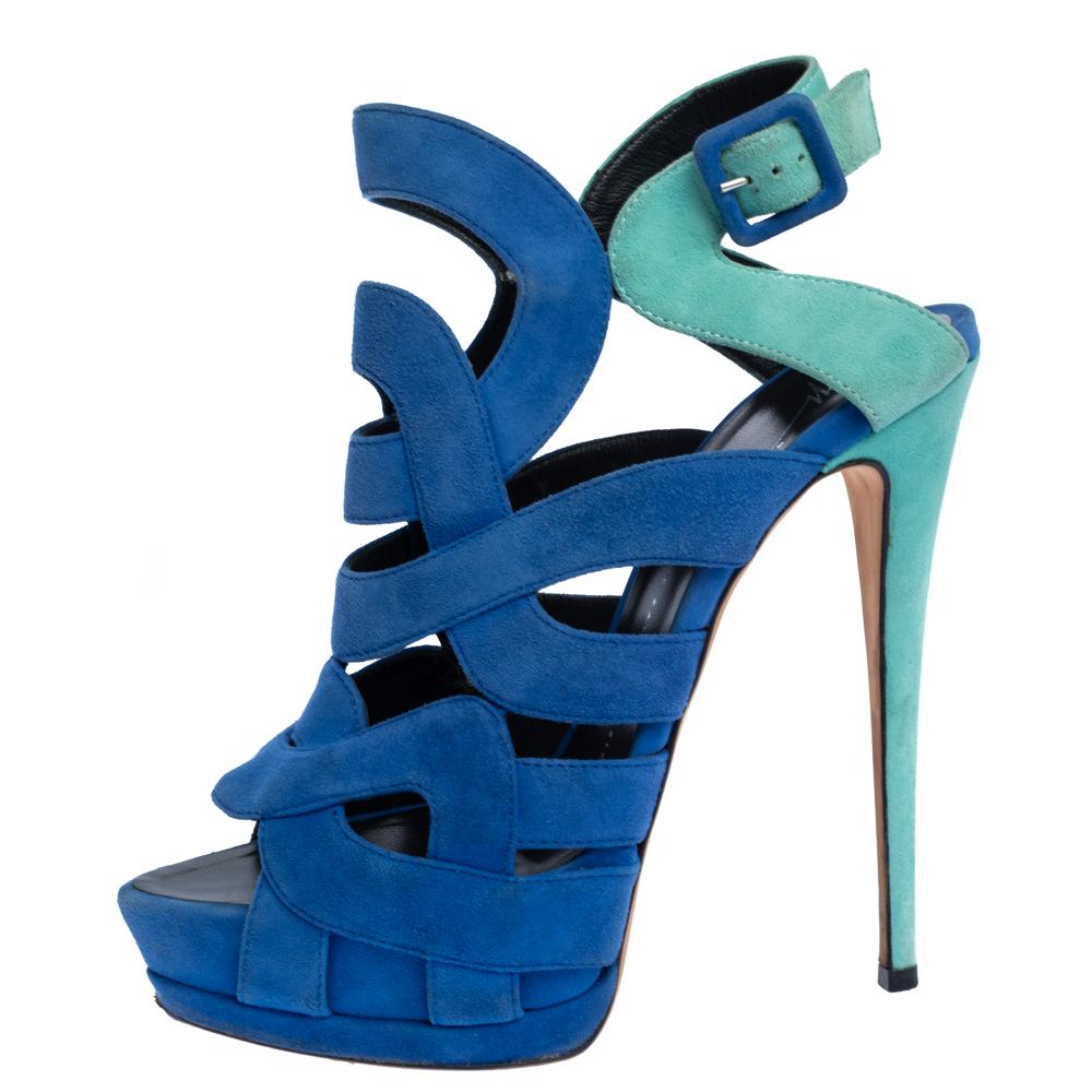 These sandals from Giuseppe Zanotti are perfect for adorning your delicate feet. The blue-hued sandals are crafted from suede and feature an open toe silhouette. They flaunt cutouts and buckle fastening. Comfortable leather-lined insoles and 16 cm