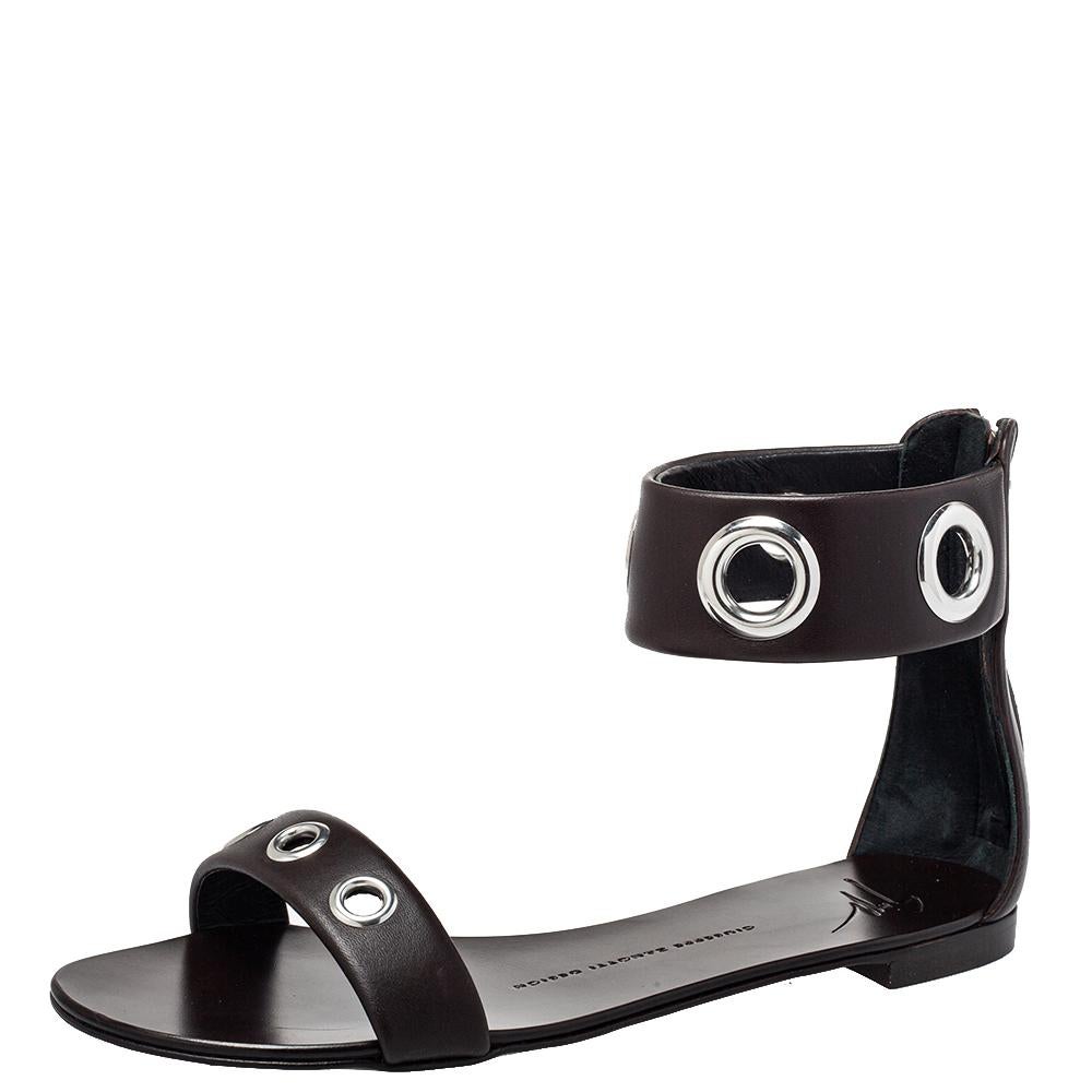 The barely-there silhouette of these Giuseppe Zanotti sandals makes them look stylish. Crafted from leather in a black shade, they are accented with slender straps decorated with oversized eyelets.

Includes: Original Dustbag, Original Box, Info