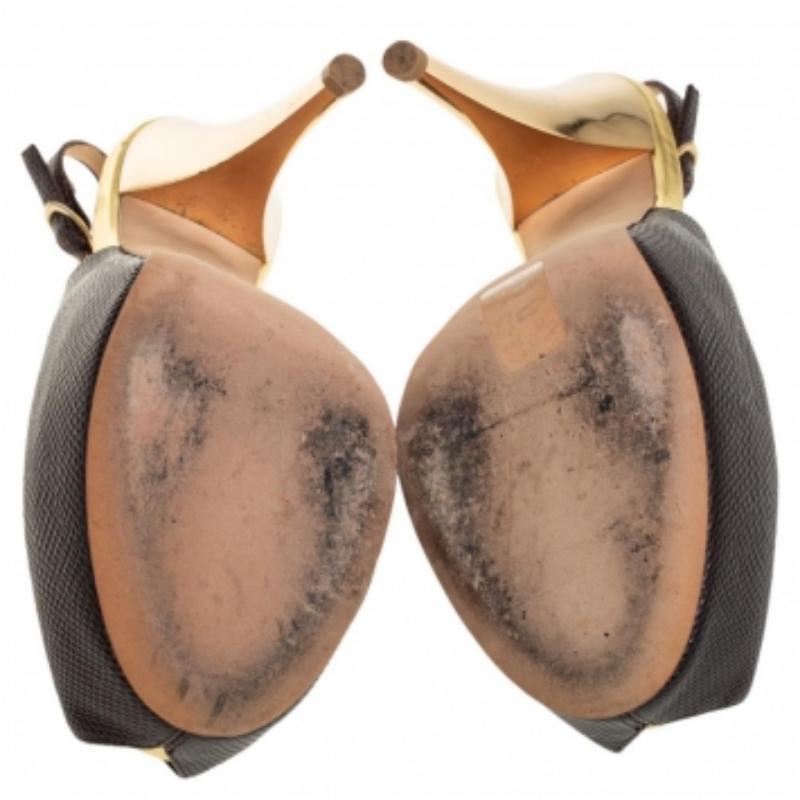 Every shoe closet deserves a pair of shoes as lovely as these slingback sandals from Giuseppe Zanotti. They've been crafted from brown leather and enhanced with gold leather, peep toes, buckle-held slingbacks, and 13 cm heels supported by platforms.