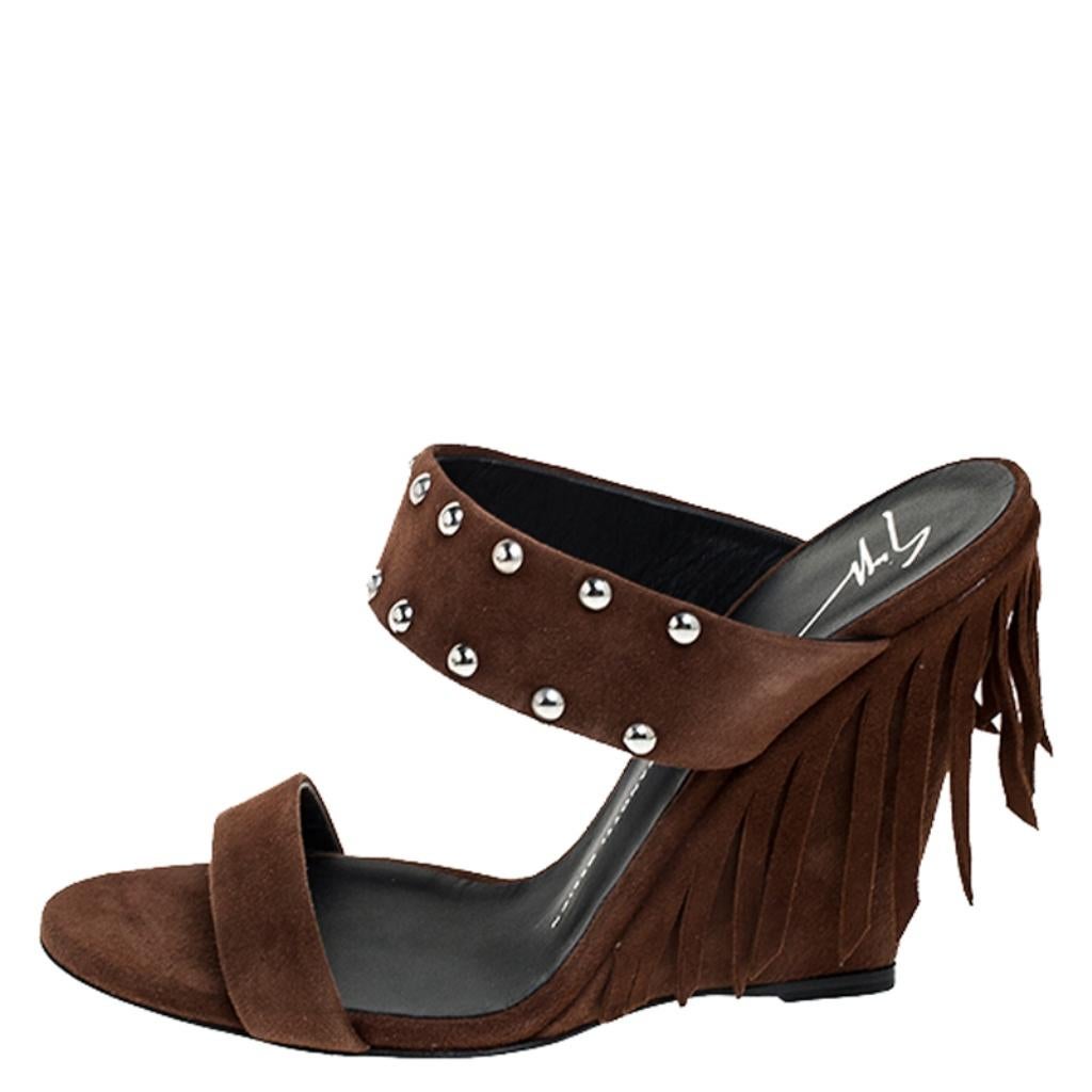 A perfect mix of elegant fashion and comfortable style, these brown Giuseppe Zanotti sandals come crafted from suede and designed with open toes, studs and fringes. They're visually stunning and they stand tall on 11.5 cm wedge heels.

Includes: