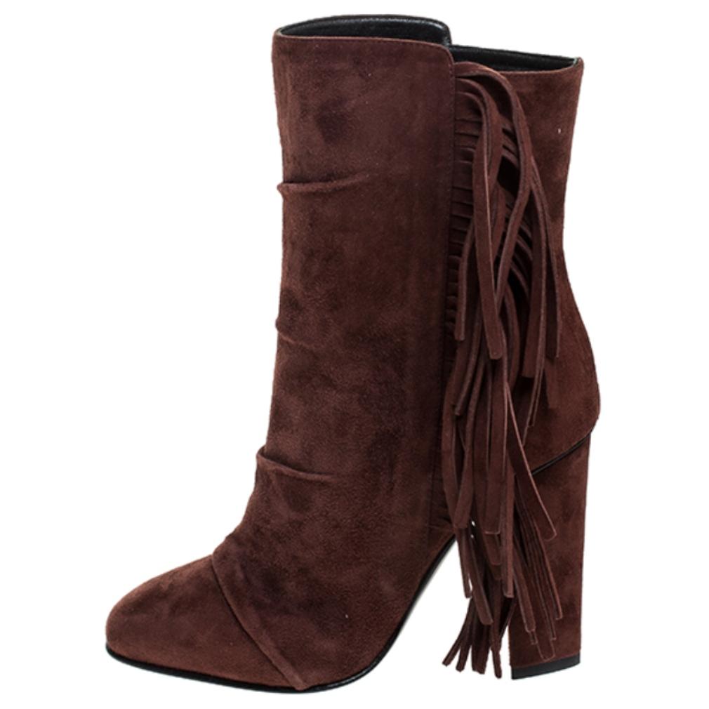 Make a style statement every time you wear these brown boots from Giuseppe Zanotti! Beautifully crafted from suede, these mid-calf boots carry fringe details, 10 cm block heels and leather insoles. Waltz around town in this lovely pair!

Includes: