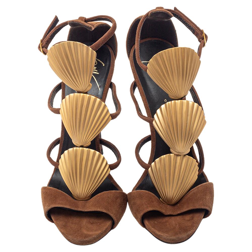 These sandals from Giuseppe Zanotti are utterly gorgeous! The sandals are crafted from suede and designed in a strappy layout with seashell motifs along the front. Balanced on 12 cm heels, this lovely pair will have everyone in admiration.

