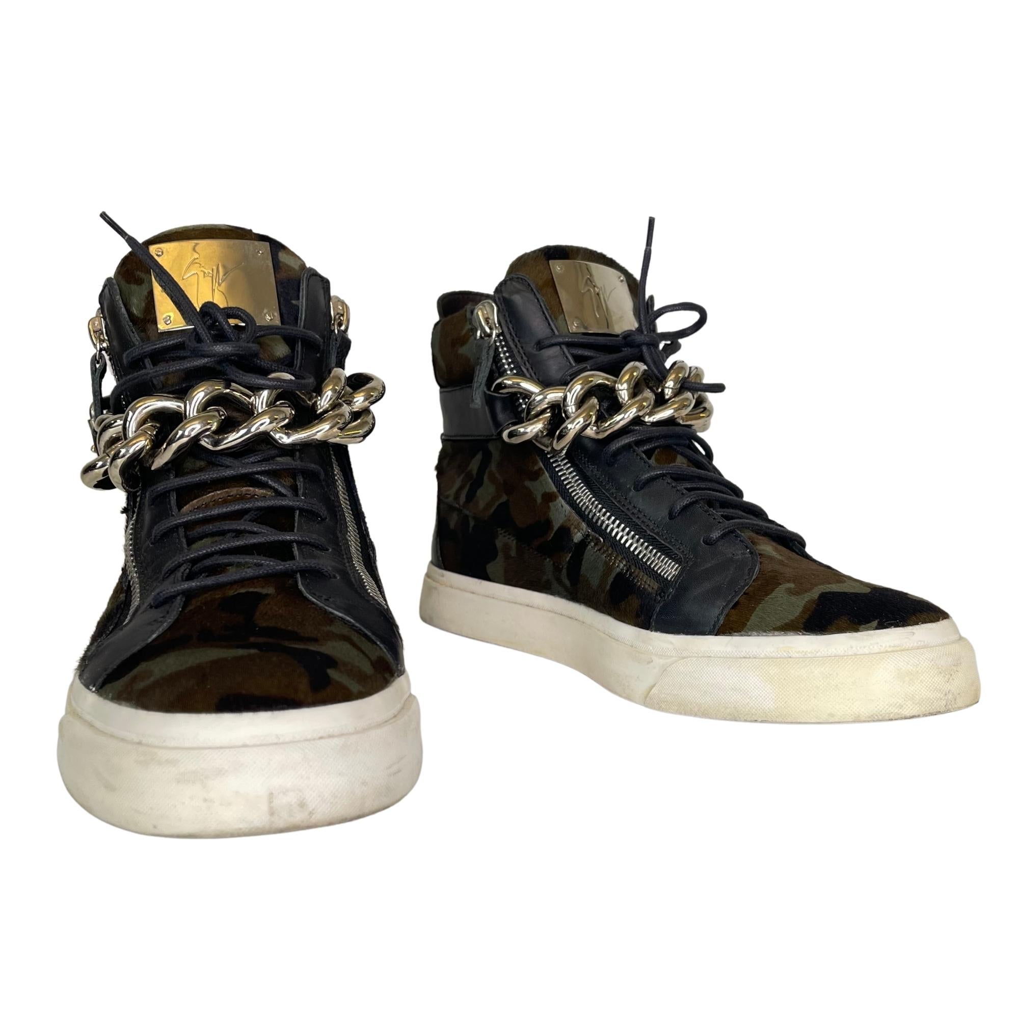 Made from calf hair, these sneakers come flaunting suave details like the chunky chains over the laces and the zippers.

COLOR: Camouflage/ Green and black
MATERIAL: Calf hair
SIZE: 43 EU / 10 US
COMES WITH: Dust bag and box
CONDITION: Good - the