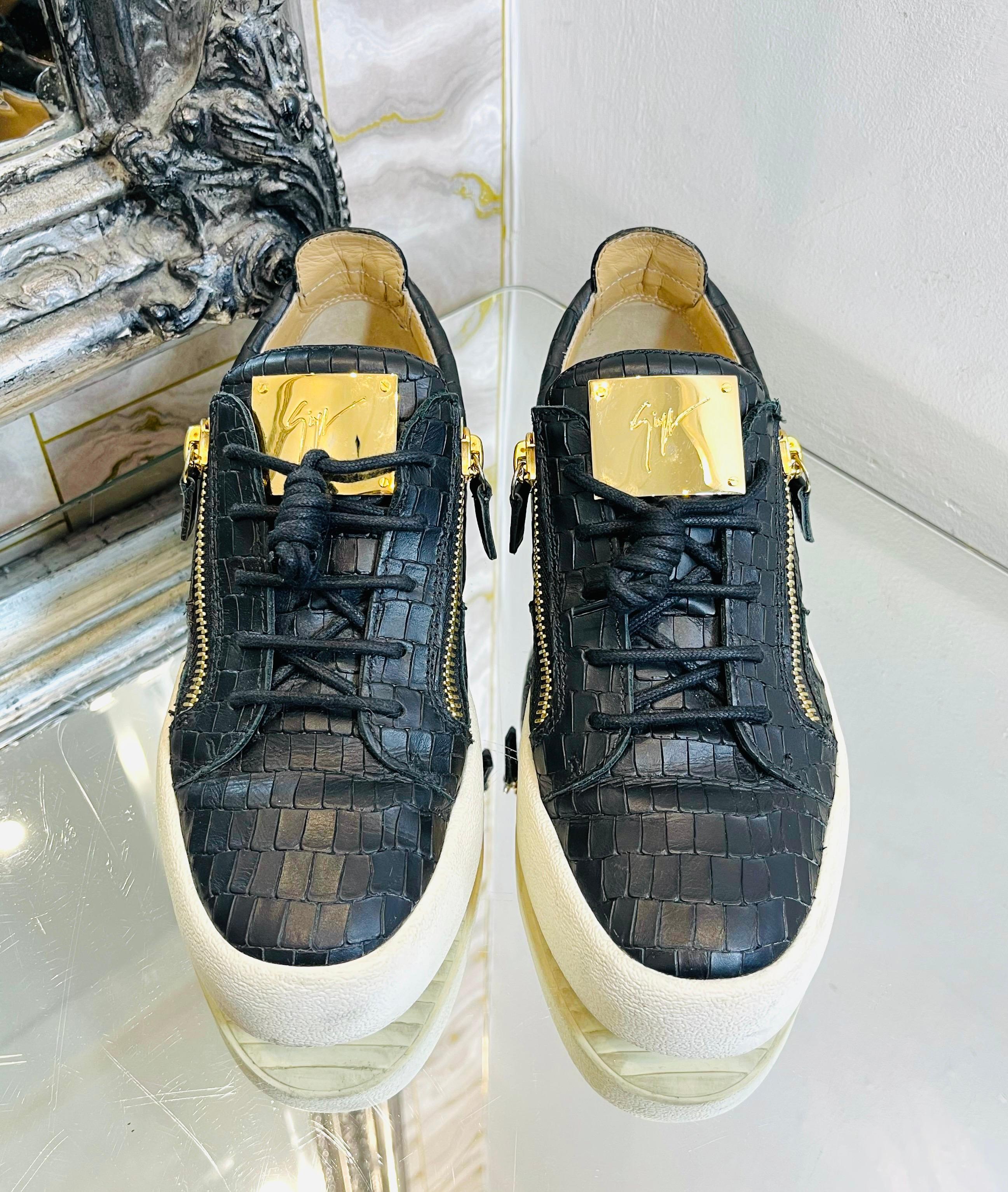 Giuseppe Zanotti Croc Embossed Leather Sneakers

Black sneakers crafted from crocodile embossed leather.

Detailed with gold double zip accents to the sides and 'Giuseppe Zanotti' logo engraved plaque to the tongue.

Featuring round toe, lace-up