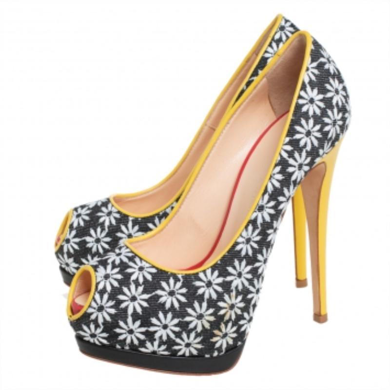 Own this meticulously designed pair of Giuseppe Zanotti pumps today and dazzle everyone whenever you step out! Crafted out of floral printed fabric and leather,  these pumps feature peep-toes. They have been beautified with 14 cm heels and solid