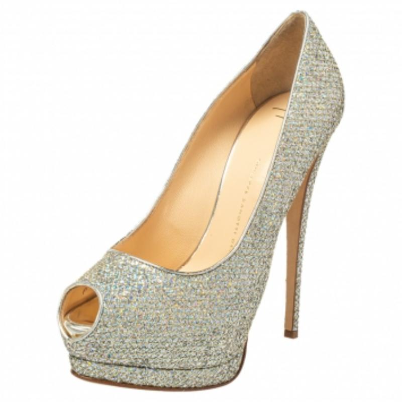 These gorgeous silver pumps from Giuseppe Zanotti are set on solid platforms and 15 cm high heels. They have been crafted from glitter and leather and styled with peep-toes. They are complete with comfortable leather-lined insoles and will never