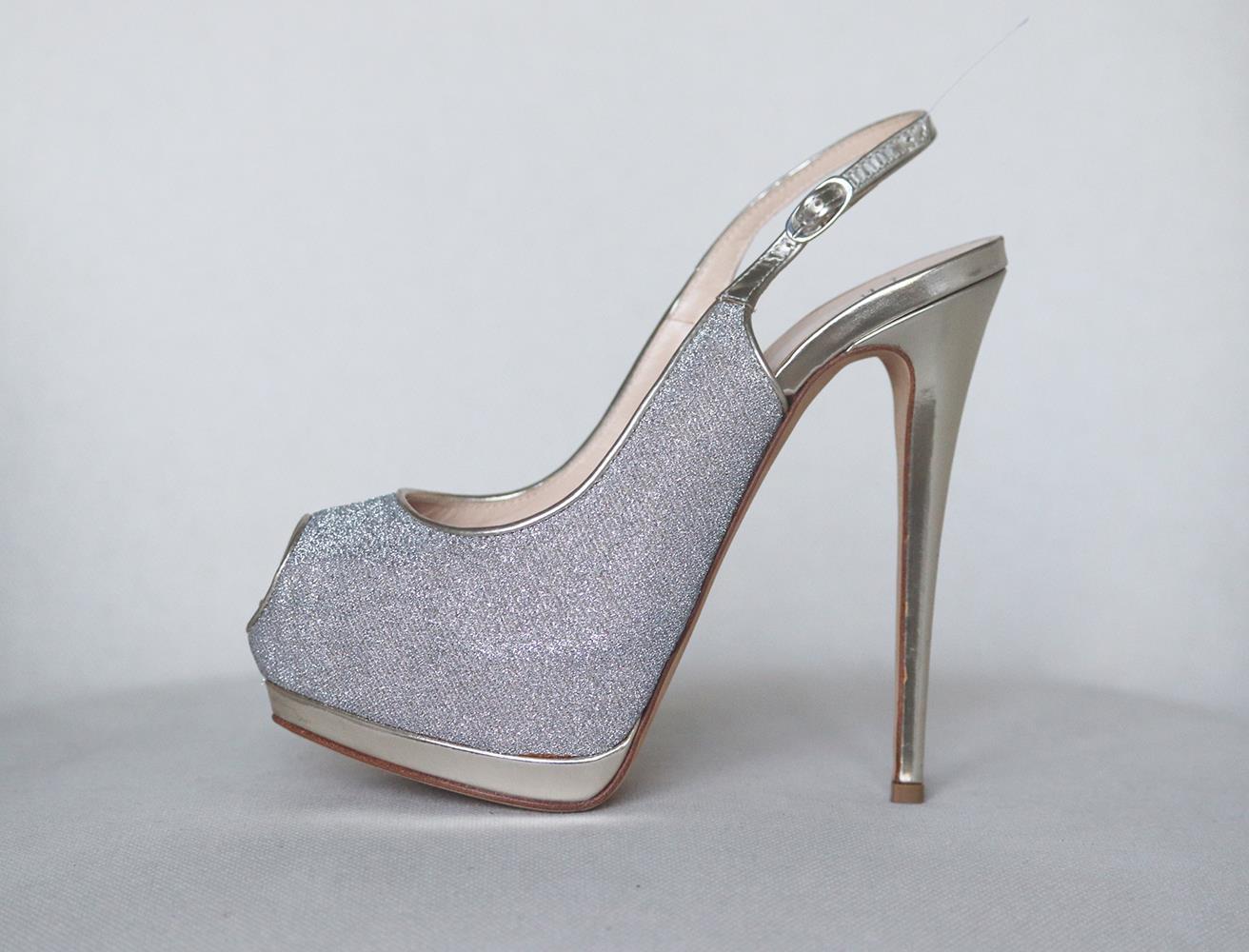 Giuseppe Zanotti's pumps have been made in Italy from silver glitter and gold mirrored leather, they're set on a towering 120mm stiletto heel that's balanced by a concealed platform and have a peep-toe silhouette and slingback fastening. Heel