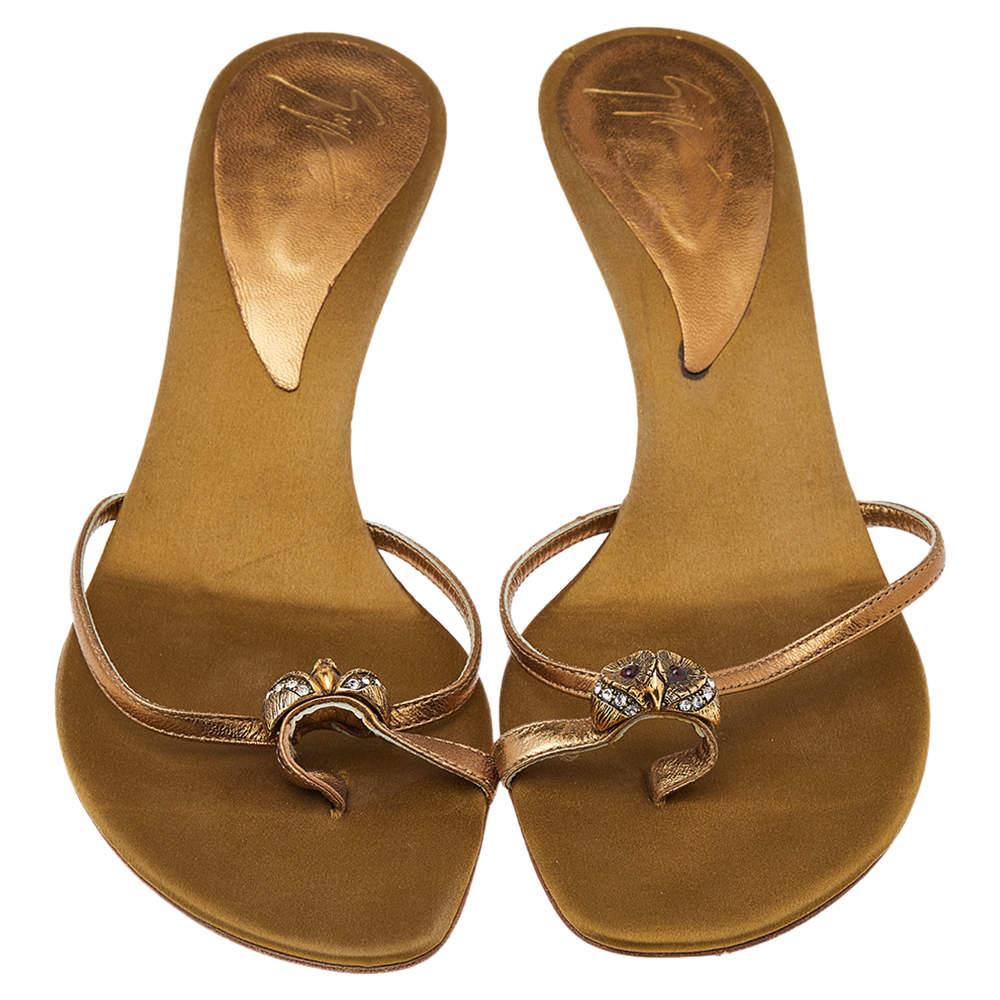 Giuseppe Zanotti understands your need for comfort and style in these flats. This impressive pair of leather sandals feature crystals to make a striking style statement. The dainty gold pair will look elegant with any ensemble.

