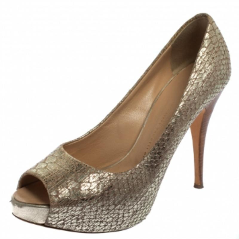 These glamorous Giuseppe Zanotti pumps will bring the right amount of style and shine to your feet. They feature a metallic gold python-embossed leather body, peep-toes, platforms, and 11 cm heels. They are pretty and easy to flaunt.