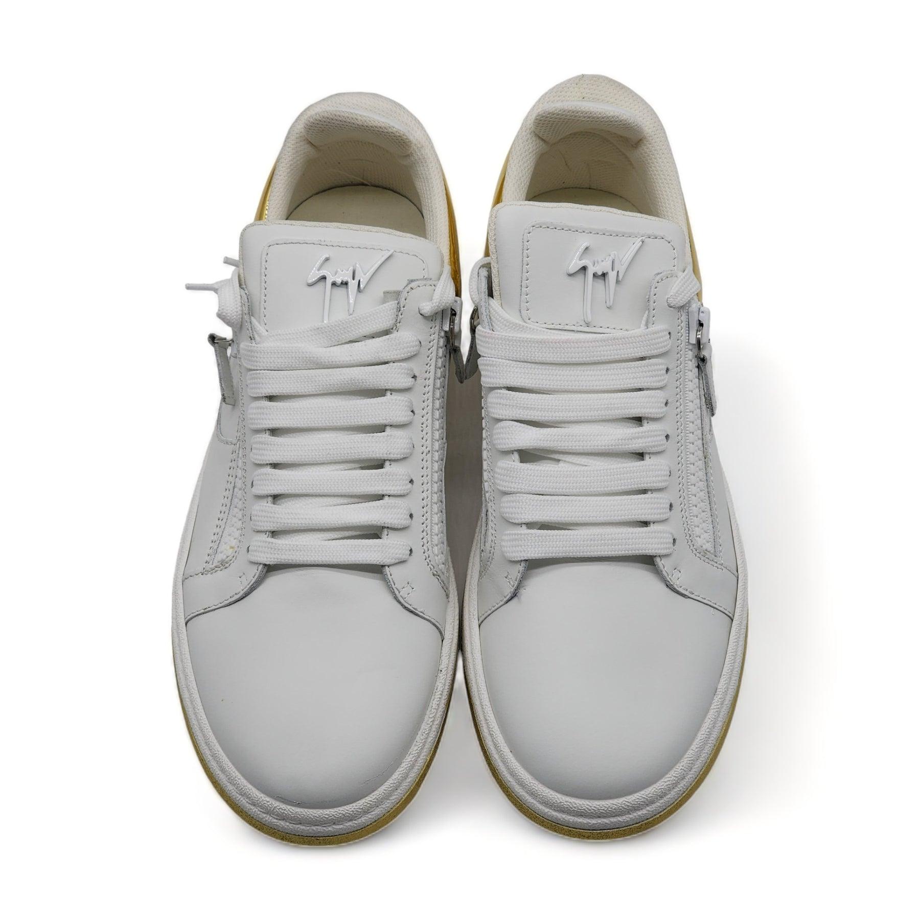 Sneakers crafted from white leather and golden synthetic fabric with a mirror effect. 

Additional information:
Material: Leather, Rubber
Highlights: Leather upper, Round toe, Lace-up vamp, Side zip details, Leather lining, Rubber sole, Lining: