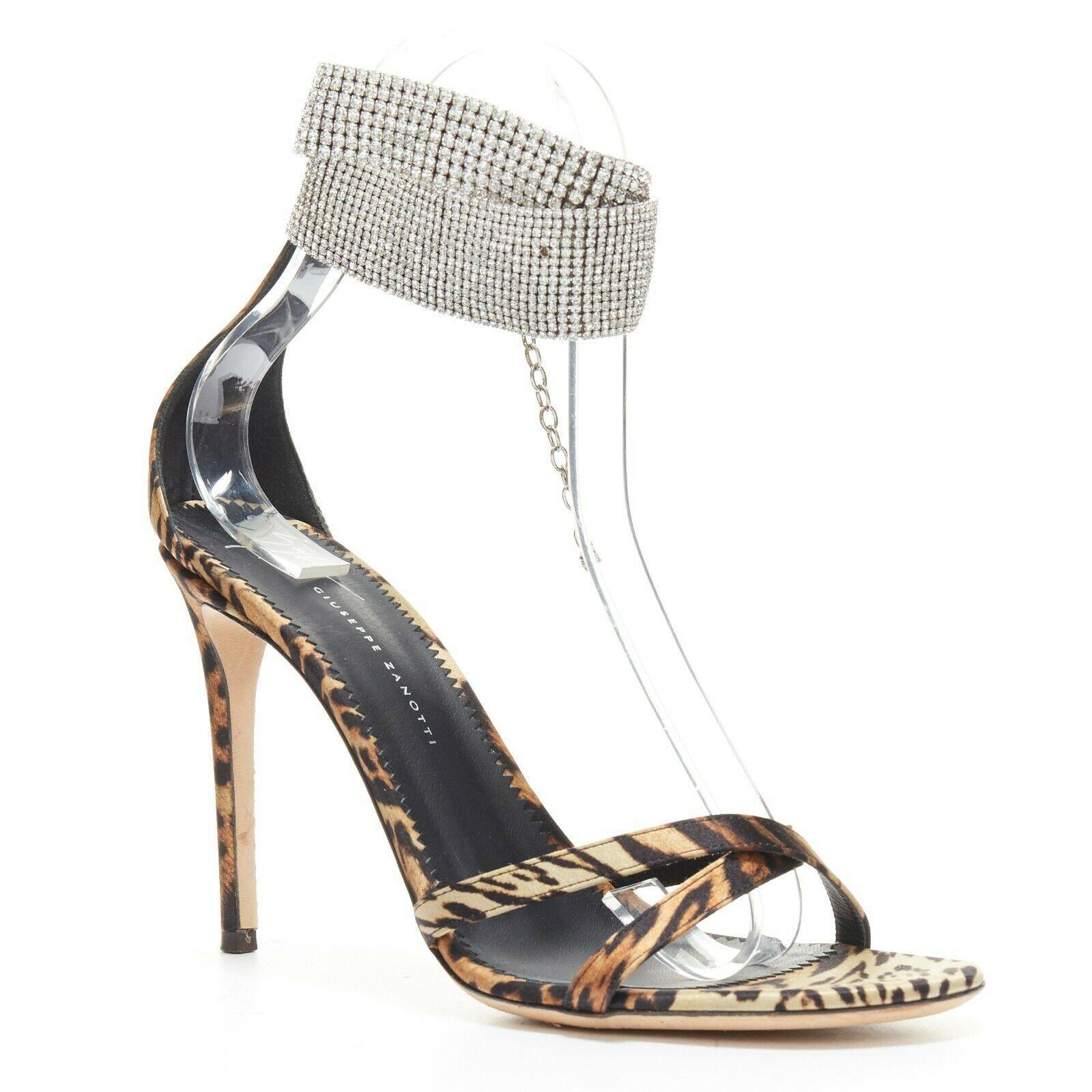 GIUSEPPE ZANOTTI Janell leopard print crystal ankle strap high heel sandal EU39
GIUSEPPE ZANOTTI
Janell sandals. Brown black leopard print fabric upper. Cross toe strap. 
Open toe. Crystal embellished ankle strap. 
Slim high heel. Hook closure on