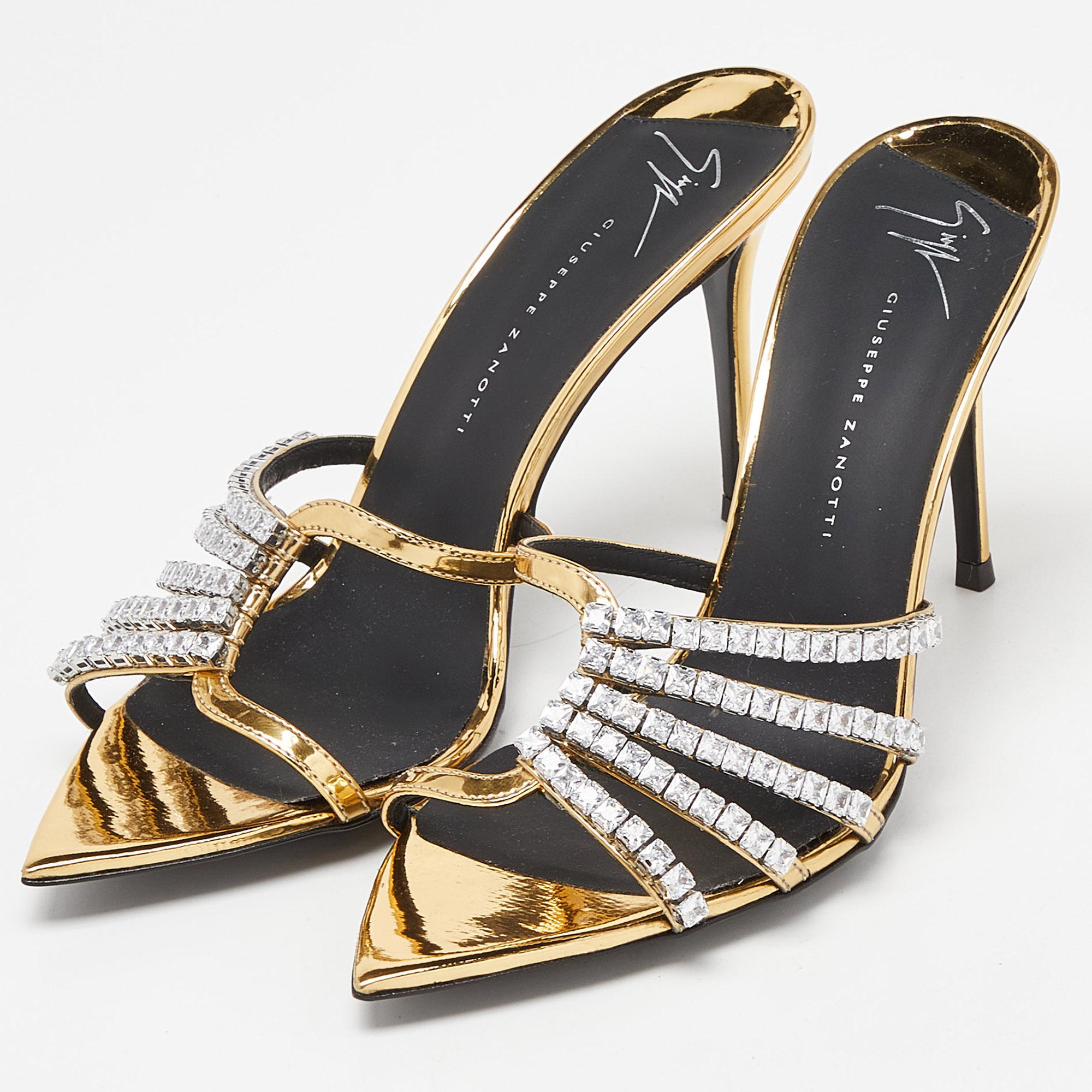 The crystal embellishment on the black upper of these Giuseppe Zanotti sandals adds an instant dose of glam to them. Made from suede, they are teamed with leather soles, a slip-on fitting, and 9 cm heels.

Includes: Original Dustbag