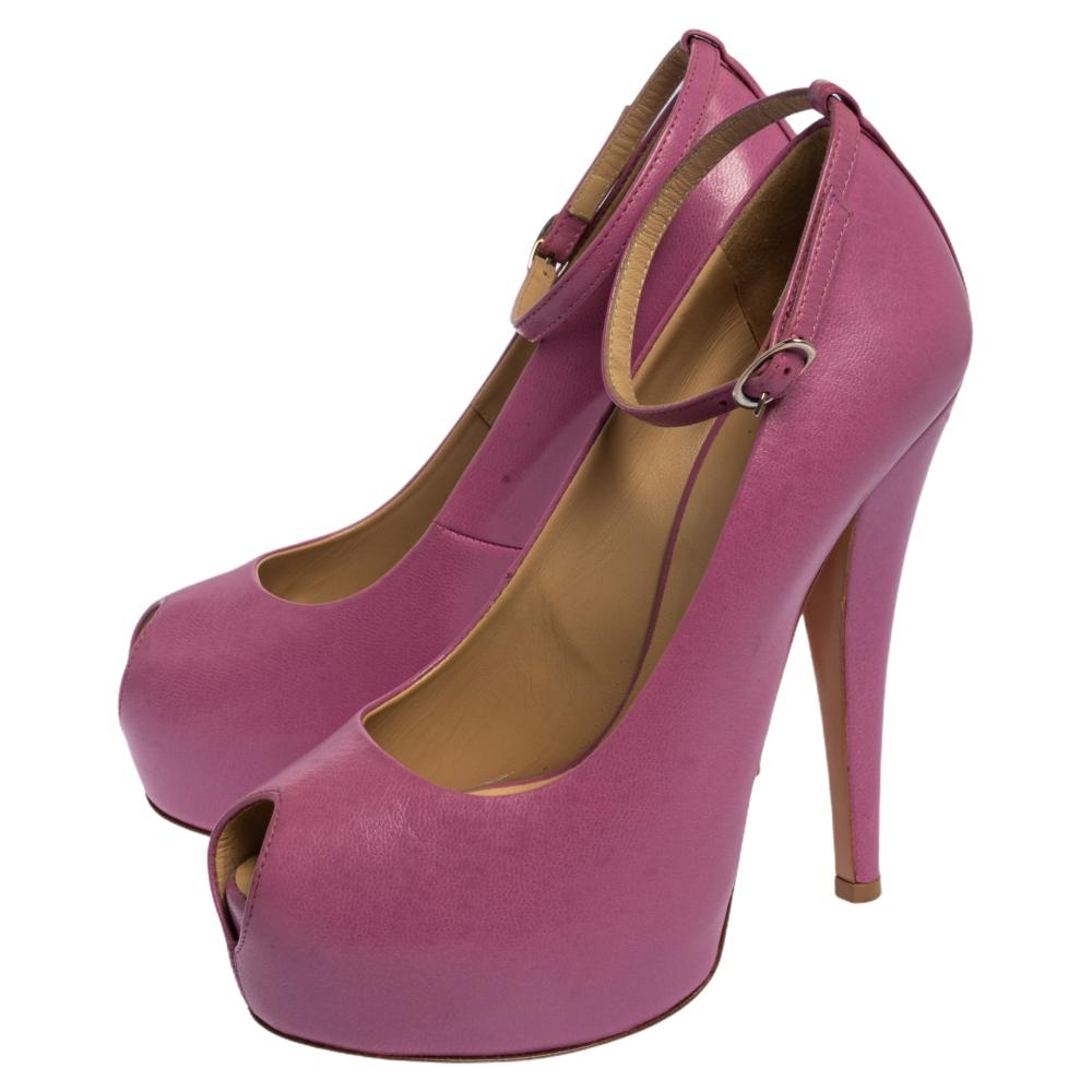 Elegance and feminine style are what these Giuseppe Zanotti pumps offer! The lilac shoes are crafted from leather and feature a peep-toe silhouette. They flaunt buckled ankle straps and come equipped with comfortable leather-lined insoles, 13.5 cm