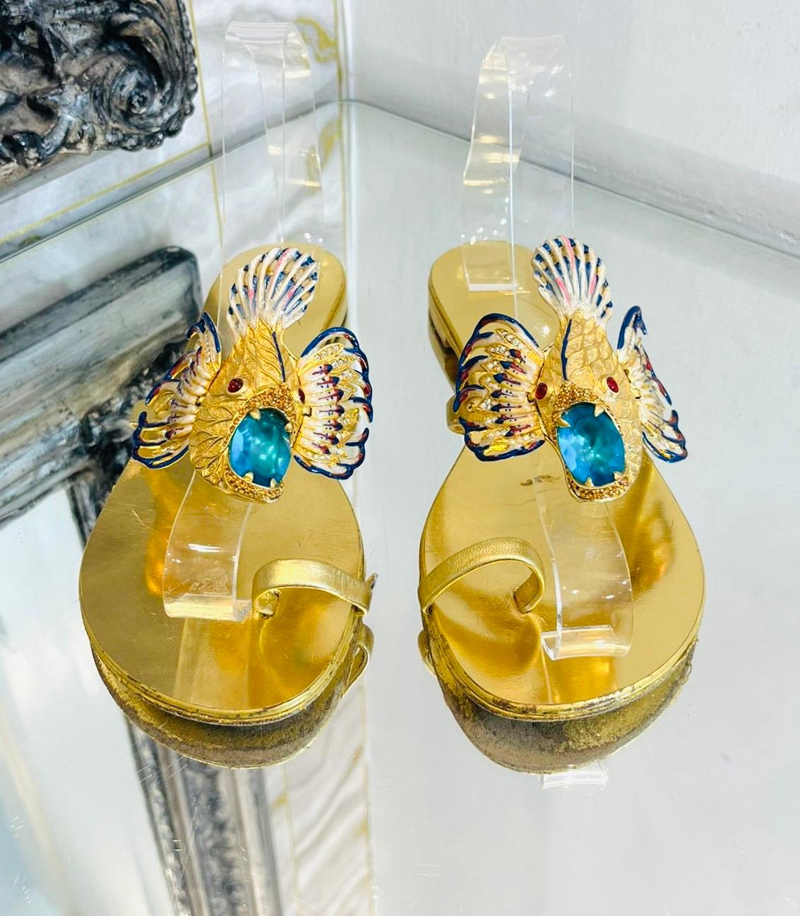 Giuseppe Zanotti Metallic Leather Embellished Sandals

Iconic sandals crafted from laminated leather and detailed with 'Spipiott' accessory covered in colourful crystals.

Featuring single toe strap and short heel. Rrp £1345

Size – 37

Condition –
