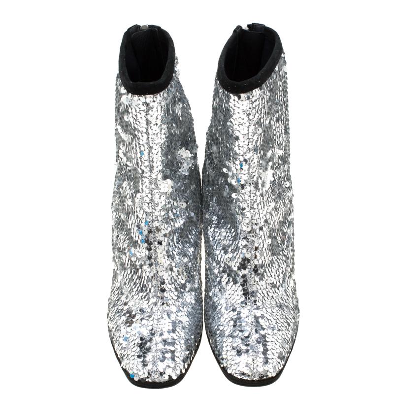 To complement your upbeat style, Giuseppe Zanotti brings you these gorgeous ankle boots that come flowing with high-fashion. They've been crafted from mesh and sequins along with suede trims. They are designed with back zippers and 10cm curved