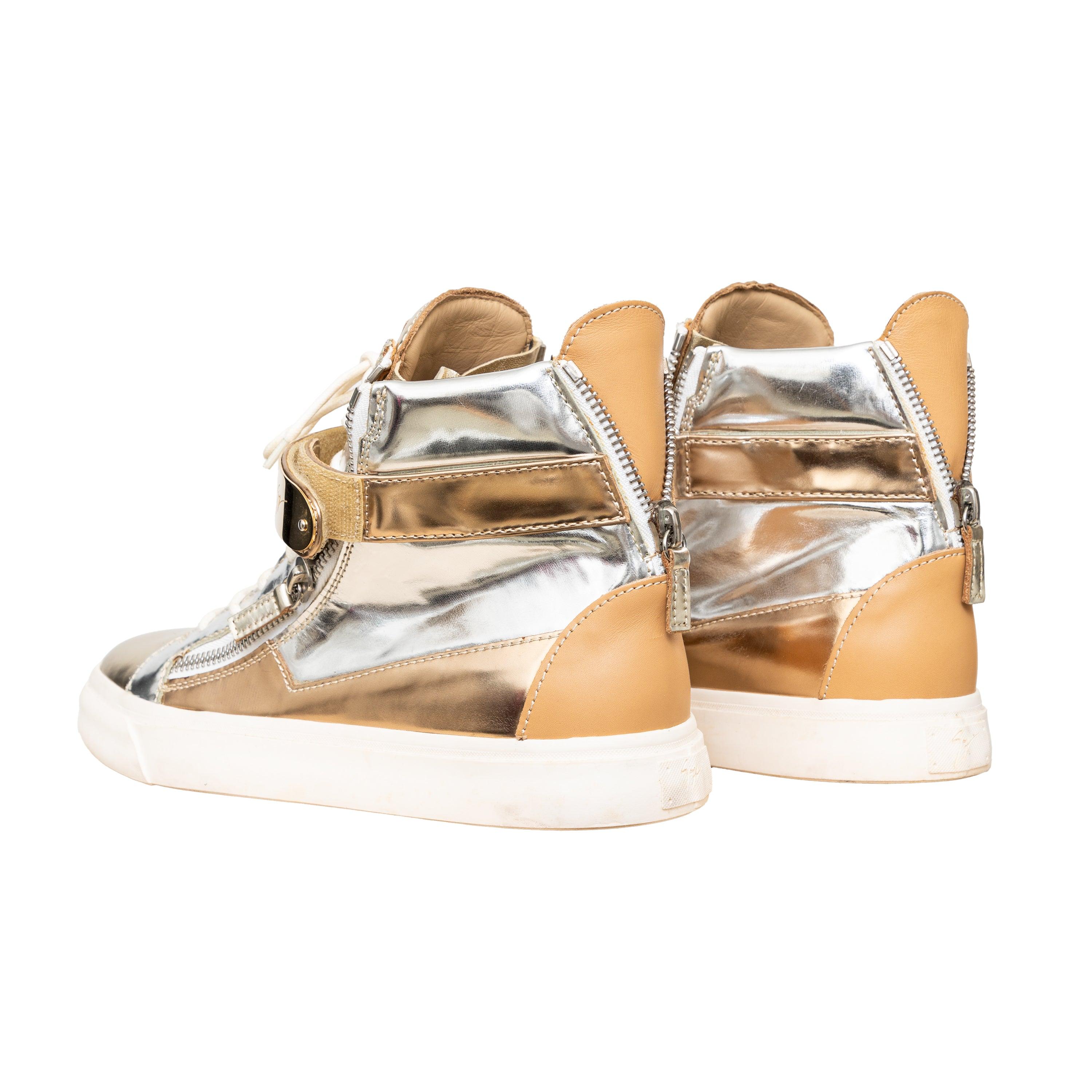 Giuseppe Zanotti Metallic Sneakers feature a duo-tone design in gold and silver, high-top style with plated closure and brown leather accents at the back.
 Remarks: there are some imperfections. 
 Measurement: Insole Length:28.5;Heel:3 
 Material: