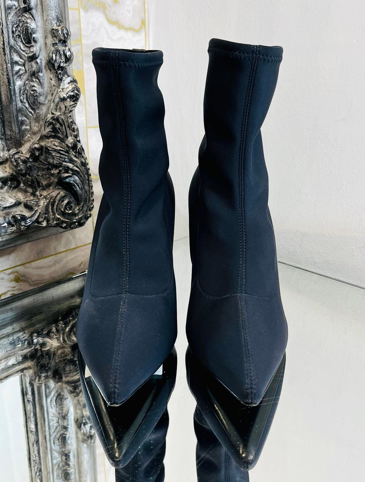 Giuseppe Zanotti Mirea Nylon Ankle Boots

Black pull-on boots designed with stretch fabric and sock-style ankle.

Detailed with pointed toe, stiletto heel and silver logo stud top rear. Rrp £675

Size – 38

Condition – Very Good (Light
