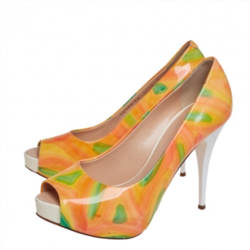 These magnificent pumps from Giuseppe Zanotti are set on solid platforms and 11 cm heels. They have been crafted from multicolor patent leather and styled with peep toes. They are endowed with comfortable leather-lined insoles and will look great