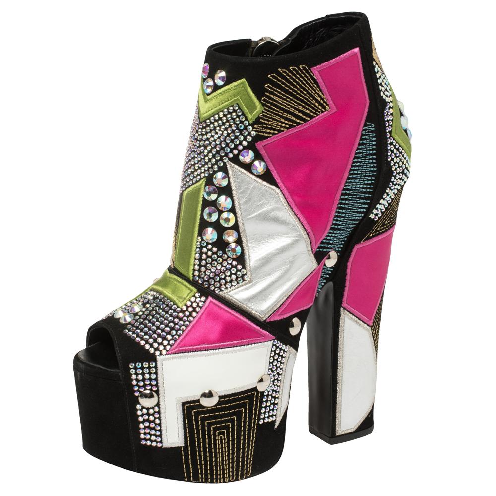Now here is one pair that truly stands out and deserves all your attention! These multicolor ankle booties from Giuseppe Zanotti have been crafted from suede and leather and designed in a peep-toe silhouette with an eye-catching geometric design