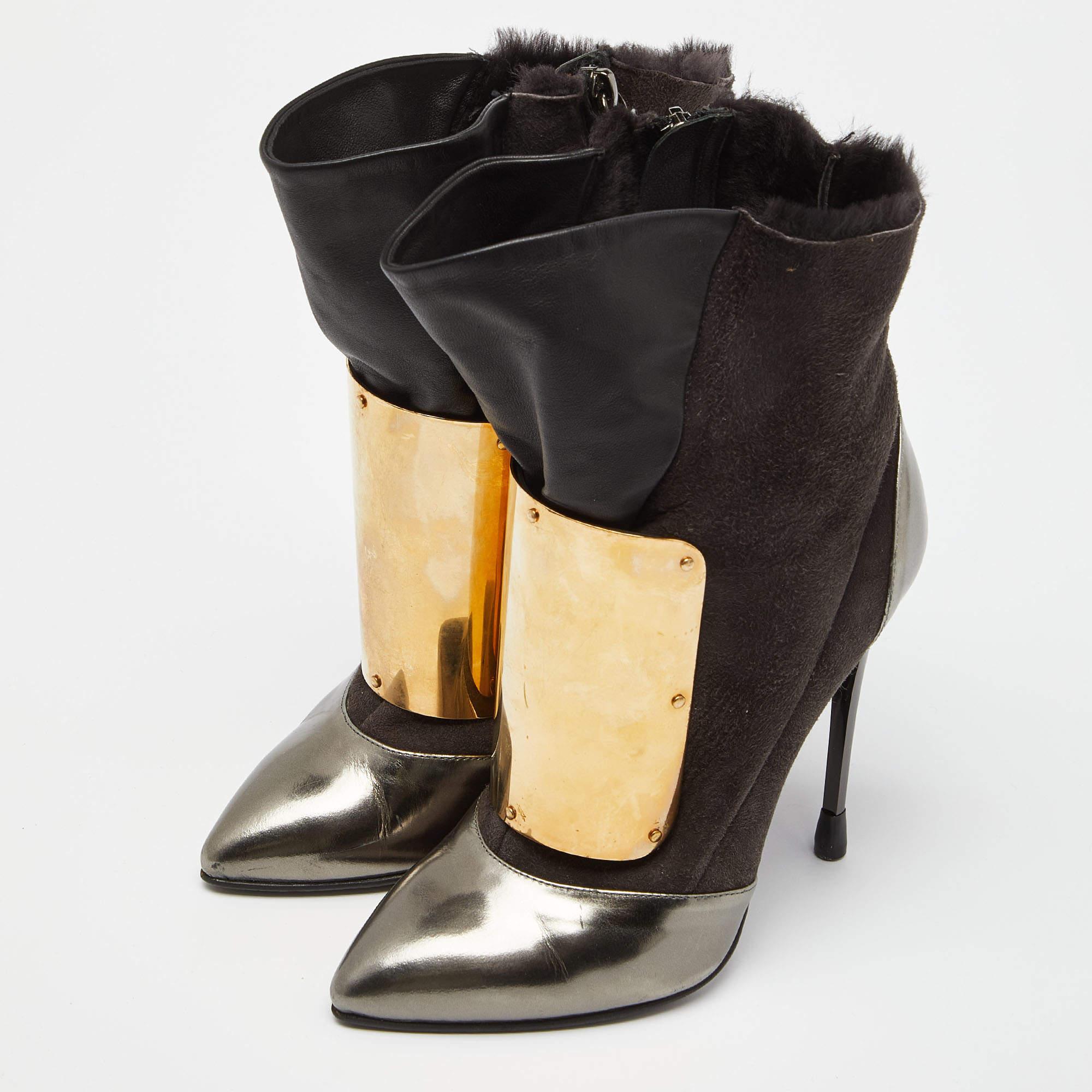 No brand understands the mix of high fashion and comfort like the house of Giuseppe Zanotti. This is a pair of black leather boots that will add a luxe touch to your ensemble. The boots feature pointed toes tough soles side zippers and sturdy heels.