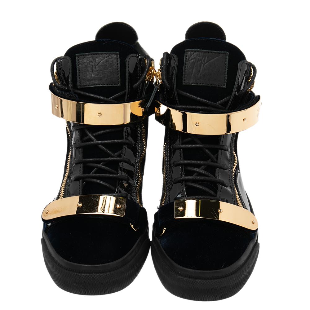 Bring home the luxurious high-fashion touch with these sneakers from Giuseppe Zanotti. Crafted from velvet and patent leather, these sneakers come flaunting suave details like the double velcro straps, the lace-up, and the zipper details. You