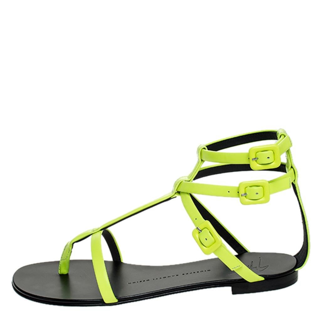 You'll be in utter love with these sandals from Giuseppe Zanotti as they are stylish and elegant. They flaunt a simple design of neon green leather straps and triple buckle detailing. They'll look perfect with dresses and casuals.

Includes:
