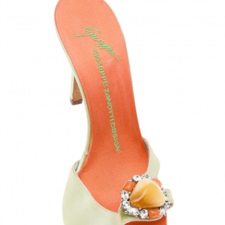 Take every step with elegance and confidence in these fabulous sandals from the House of Giuseppe Zanotti. They are crafted using neon-yellow satin, with delicate crystal embellishments adorning the front. They flaunt an easy slip-on style,