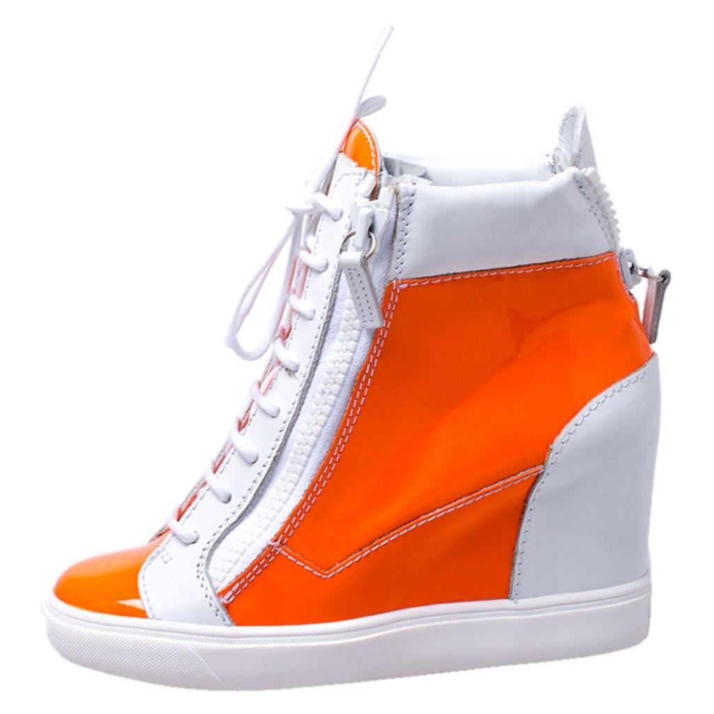 Comfort comes wrapped in these sneakers from Giuseppe Zanotti. They are crafted from patent leather and they bring details of lace-ups and zippers. Elevated on wedge heels, these sneakers are easy to wear all day without compromising on