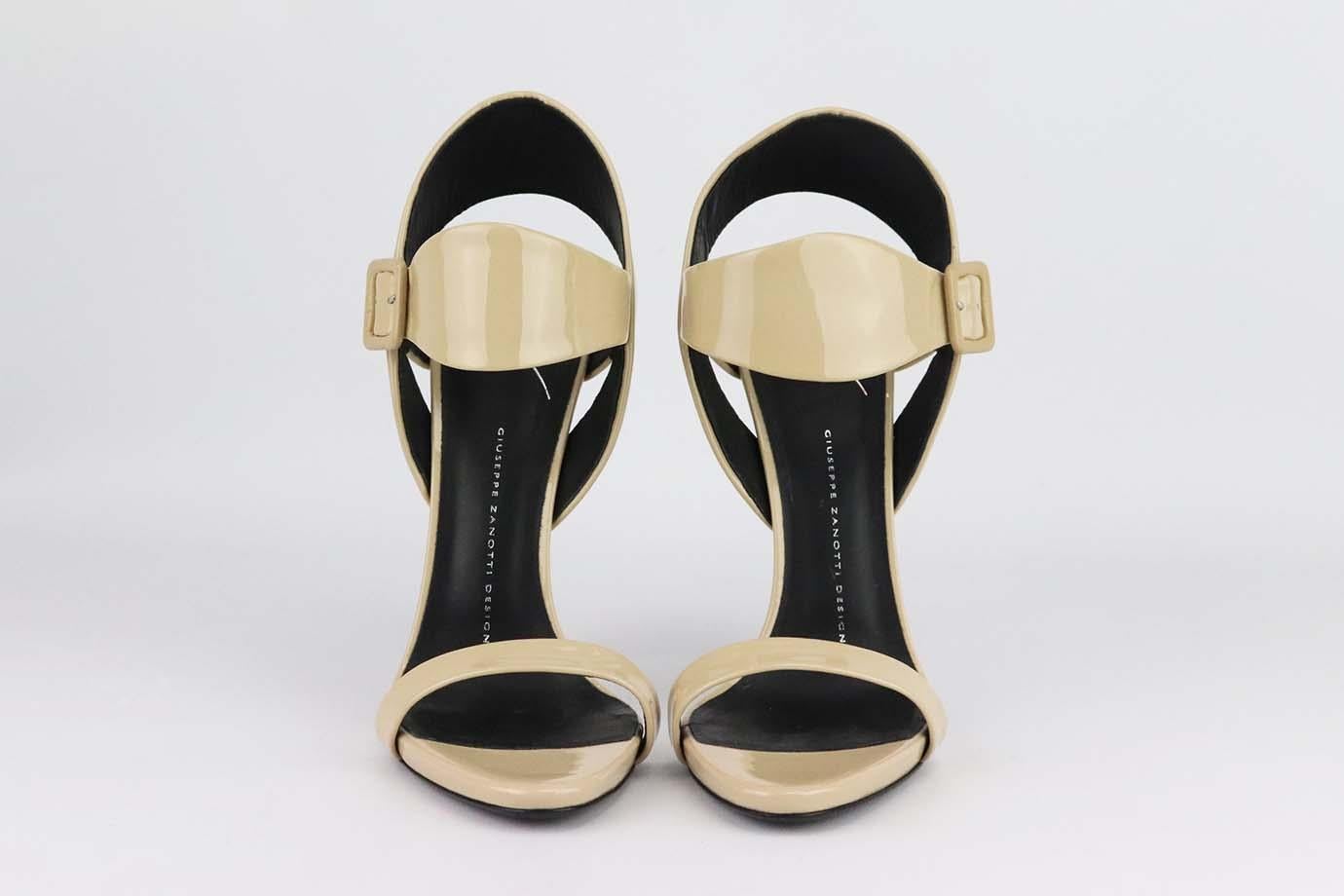 These sandals by Giuseppe Zanotti are sleek, classic and will work with virtually everything in your wardrobe, this beige glossy patent-leather pair has a graded heel and lightly cushioned insole. Heel measures approximately 101 mm/ 4 inches. Beige