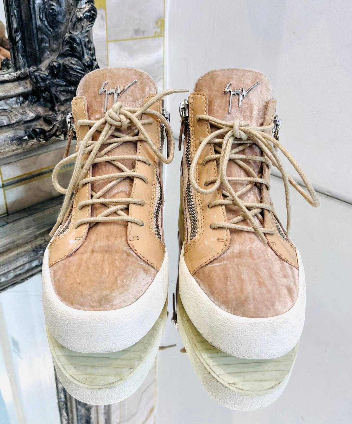 Giuseppe Zanotti Patent Leather & Velvet Sneakers

Beige velvet, lace-up sneakers designed with patent leather inserts.

Featuring silver 'Giuseppe Zanotti' logo to the tongue and zip detail on either side.

Size – 38

Condition – Very Good (Minor