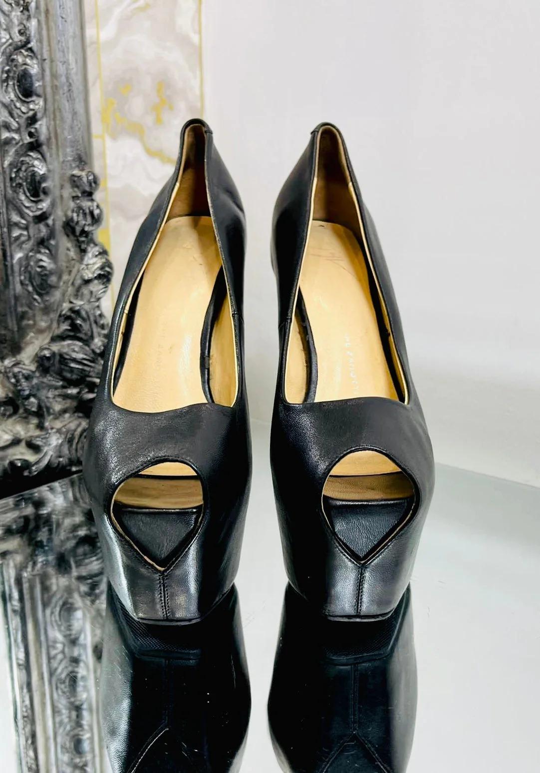 Giuseppe Zanotti Peep Toe Platform Heels

Black leather, with square fronts to the peep toes and very high heel.

Additional information:
Size – 35
Composition- Leather
Condition – Good ( Some signs of wear)
Comes With -  Shoes Only 