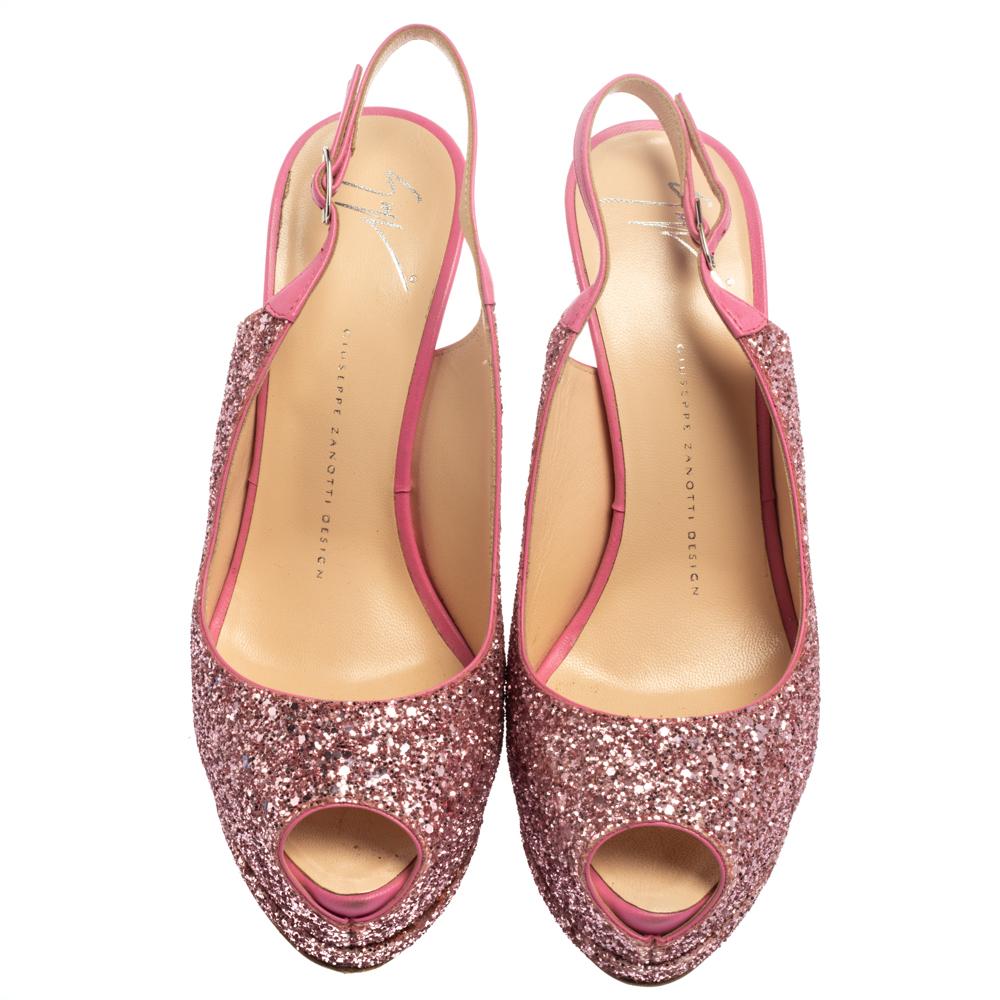 This pair of pumps by Giuseppe Zanotti will leave you looking like a diva. They are crafted from pink-hued glitter and leather. They come with peep toes, slingbacks, and 15 cm heels supported by platforms. Add glamour to your closet by slipping into