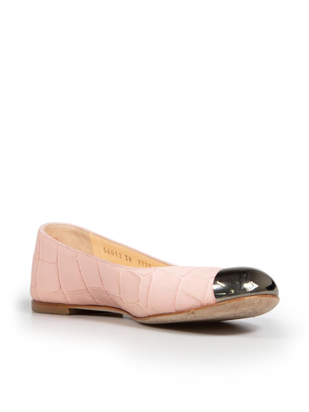 CONDITION is Good. Minor wear to flats is evident. Minor scratches on the hardware of the tips and loose stitching on the right side of the left and right shoe. Discolouration marks on the left side of the left shoe and the inner lining of the back
