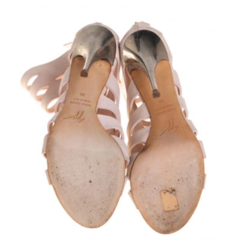 These booties from Giuseppe Zanotti are an impressive blend of comfort with style. Crafted from leather in a pink shade, the booties are detailed with cutouts and open toes. They are mounted on slender heels.