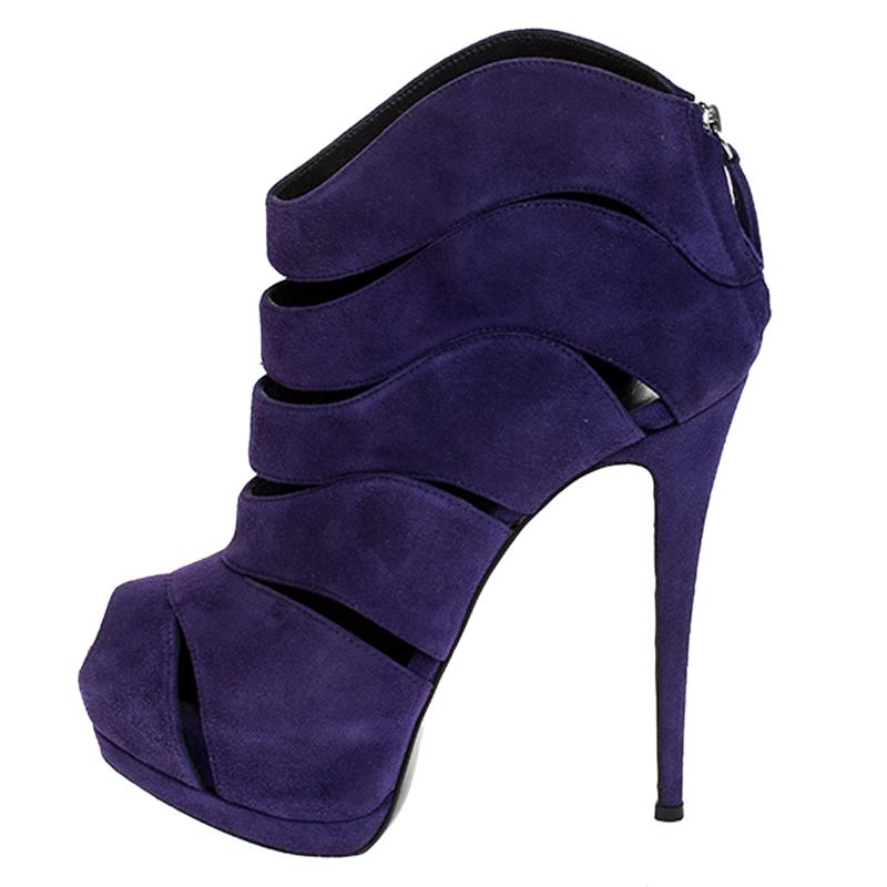 Let your feet do the talking in these gorgeous booties. Crafted from suede and designed with cutouts, this pair by Giuseppe Zanotti exudes luxury and edgy style. They feature peep-toes, 14.5 cm heels, platforms and zippers on the counters.

